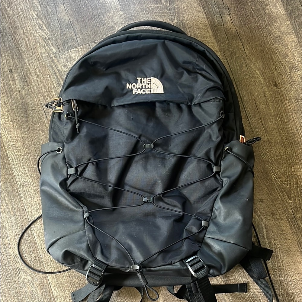 The North Face Black Backpack with Compression Straps and Technical Design